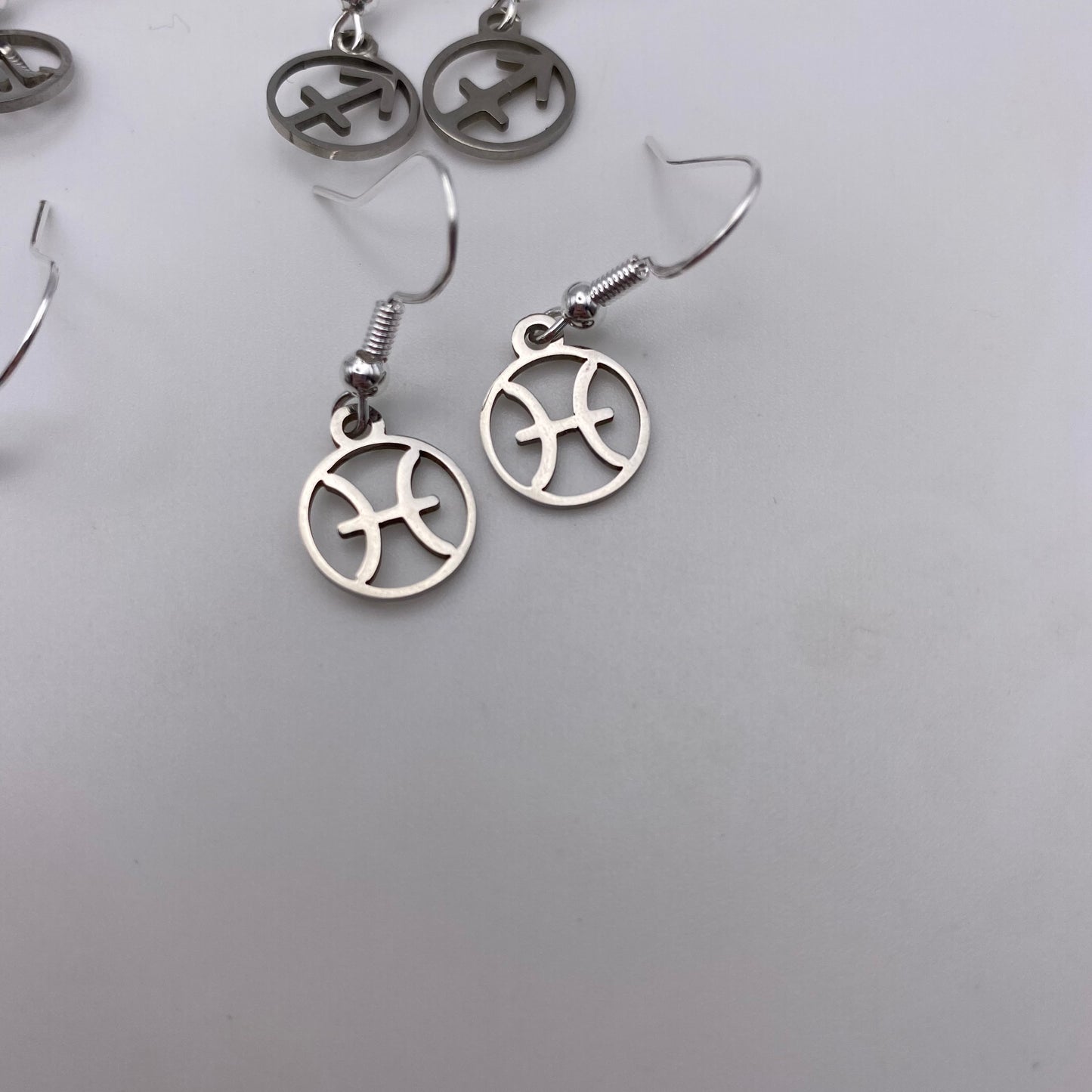 Silver Hollow Star Sign Earrings