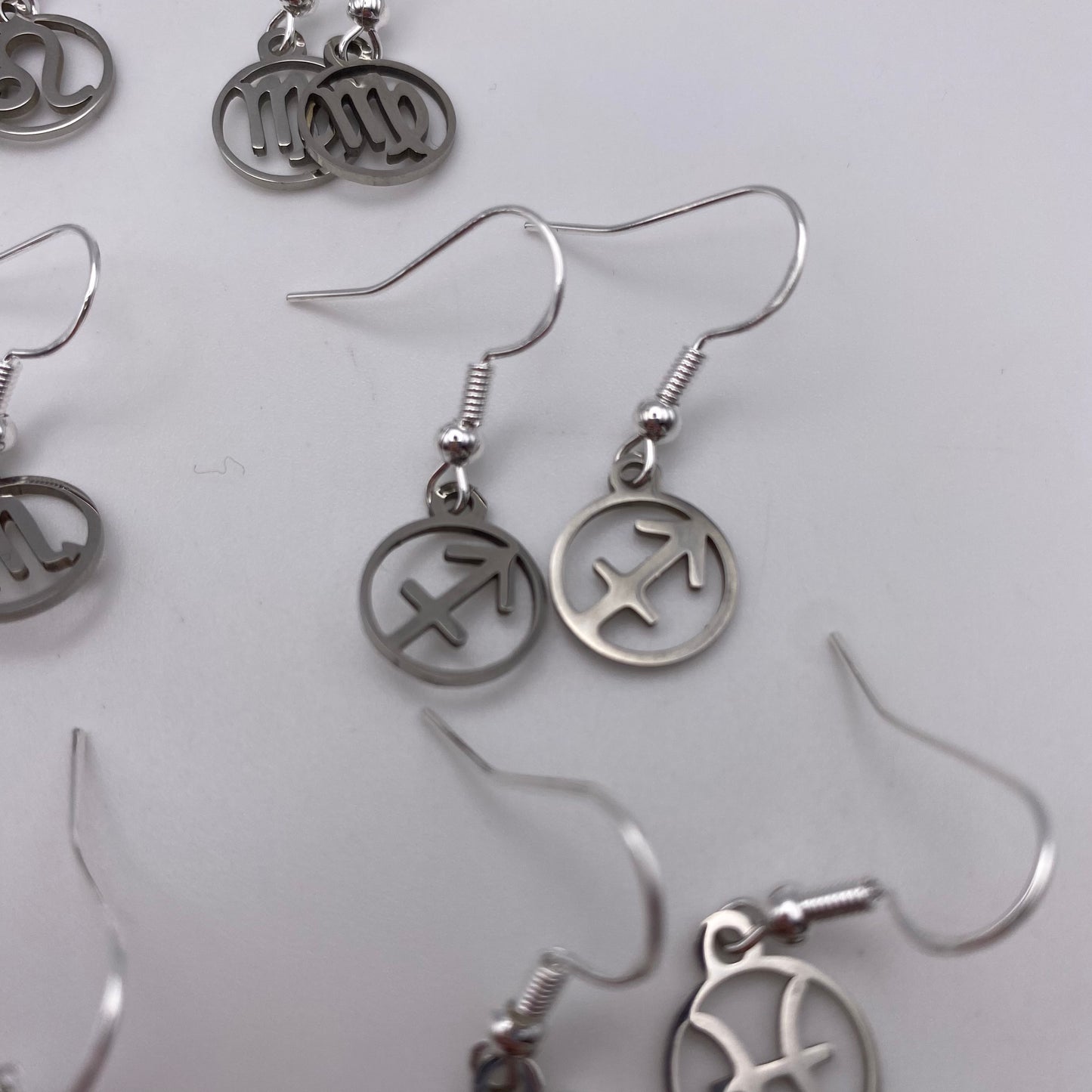 Silver Hollow Star Sign Earrings