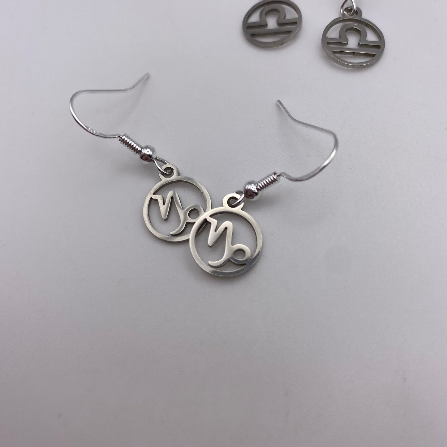 Silver Hollow Star Sign Earrings