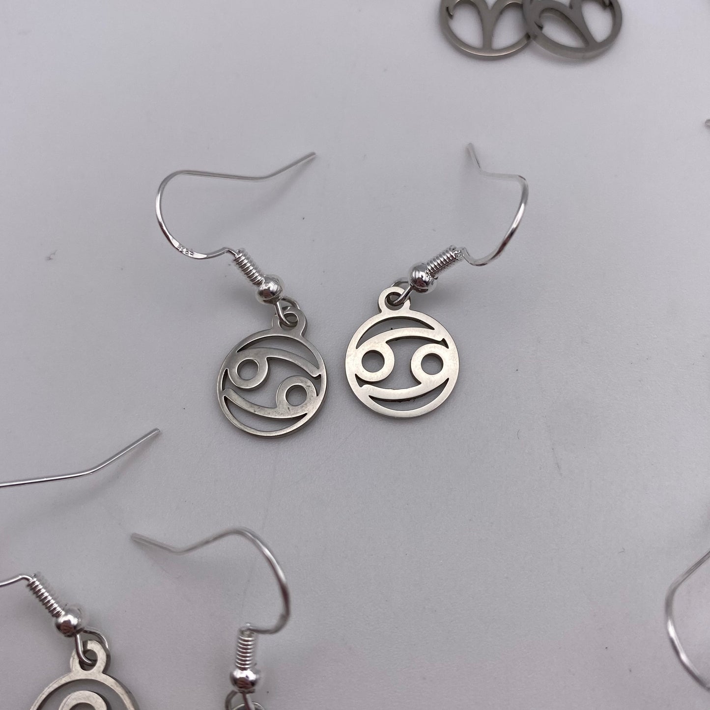 Silver Hollow Star Sign Earrings