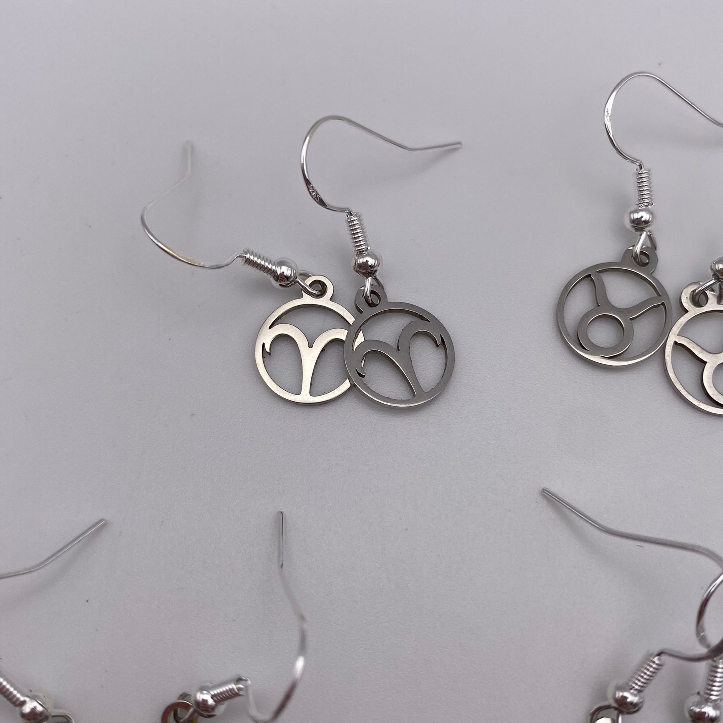 Silver Hollow Star Sign Earrings