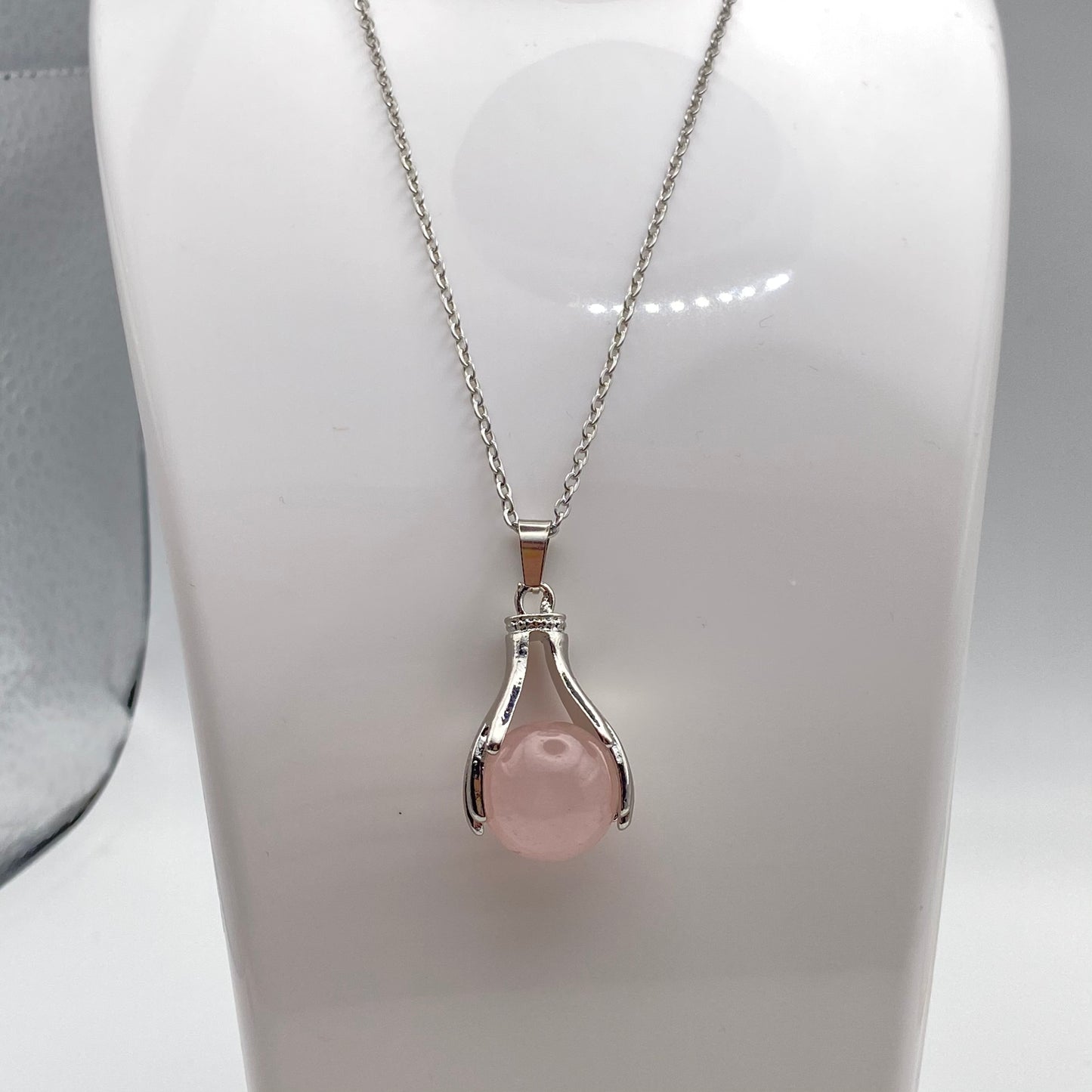 Holding Rose Quartz Crystal Pendant Necklace